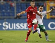 Switzerland's Xhaka fights for the ball with Bulgaria's Fernandes during their Euro 2012 Group G qualifying soccer match against Bulgaria in Basel
